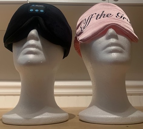 pink eyemask and wireless headphones