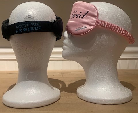 pink eyemask and wireless headphones