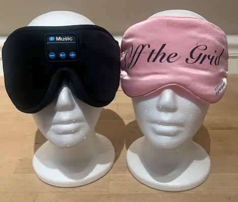 pink eyemask and wireless headphones