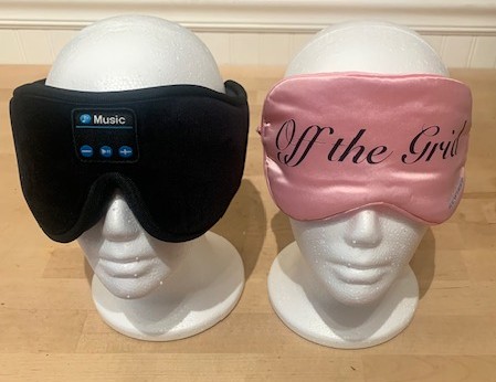pink eyemask and wireless headphones